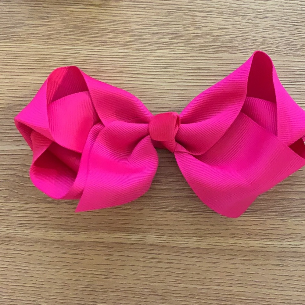 4 bows. Orange. Light blue. Pink. Dark blue.